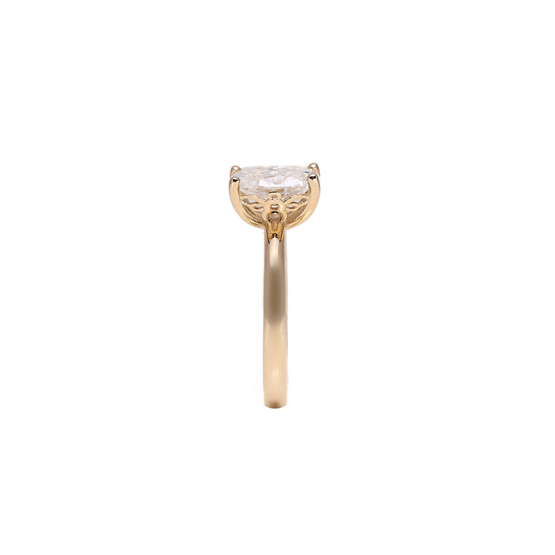 Oval engagement ring with intricate bee-inspired design, adorned with a sparkling 1.2ct diamond or lab-grown moissanite